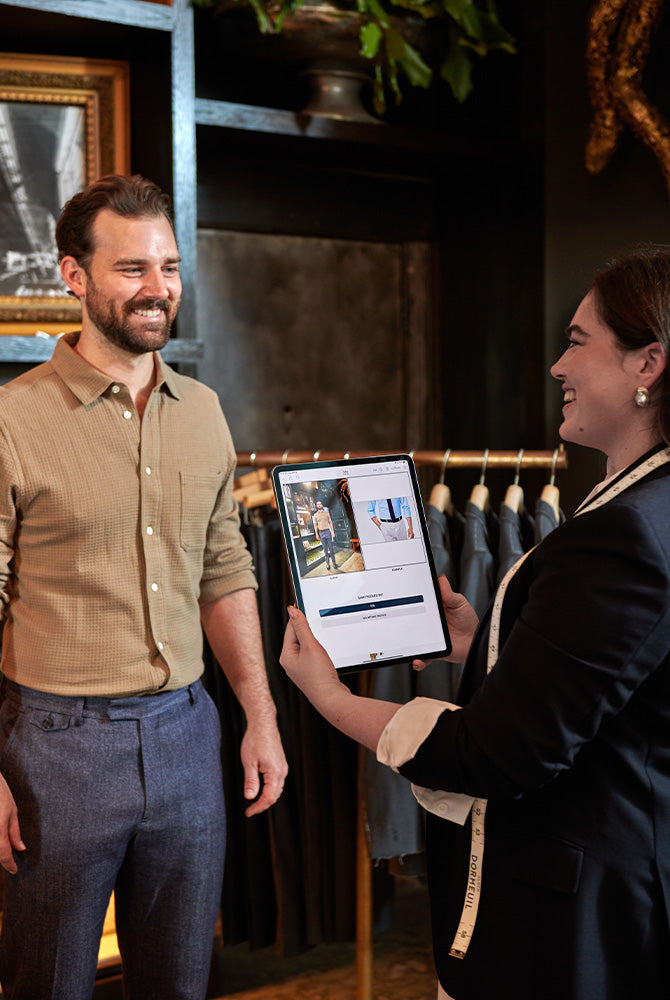 Billy Reid employee helps a customer find their perfect custom fit.