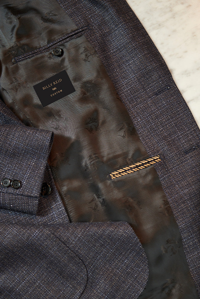 The superior quality of the suit jacket can be seen in the interior details.