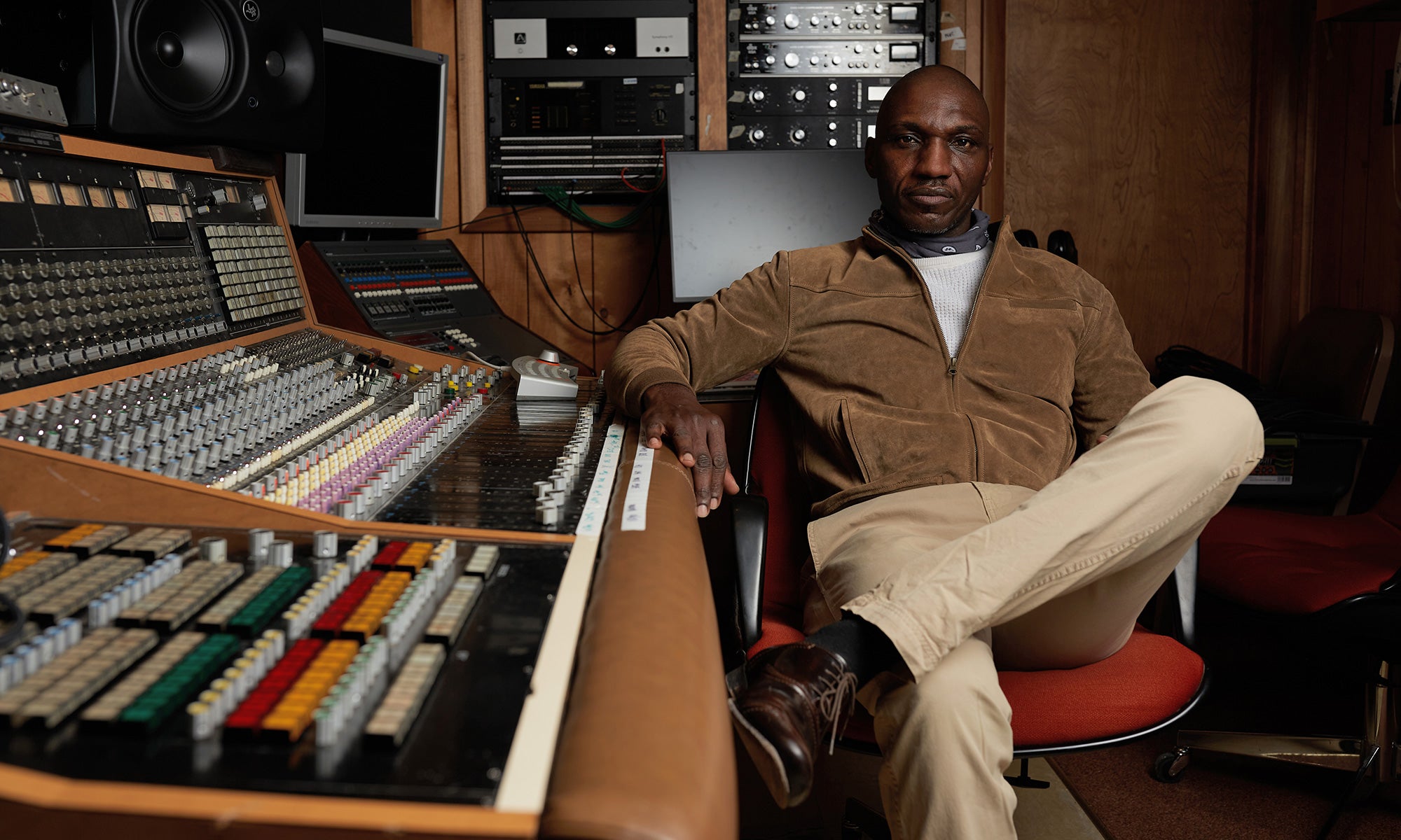 Image of Grammy-nominated singer/singwriter Cedric Burnside sitting in the recording booth at Fame Studios in Muscle Shoals