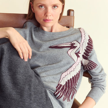 Woman wears the Intarsia Pelican Sweater
