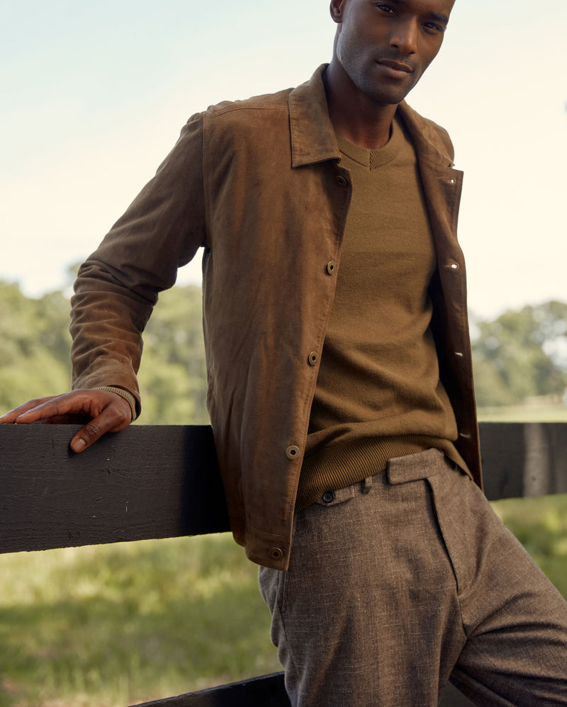 Male model wears the Billy Reid Ranch Jacket, American V Neck Sweater, and Flat Front Trouser in Brown/Black