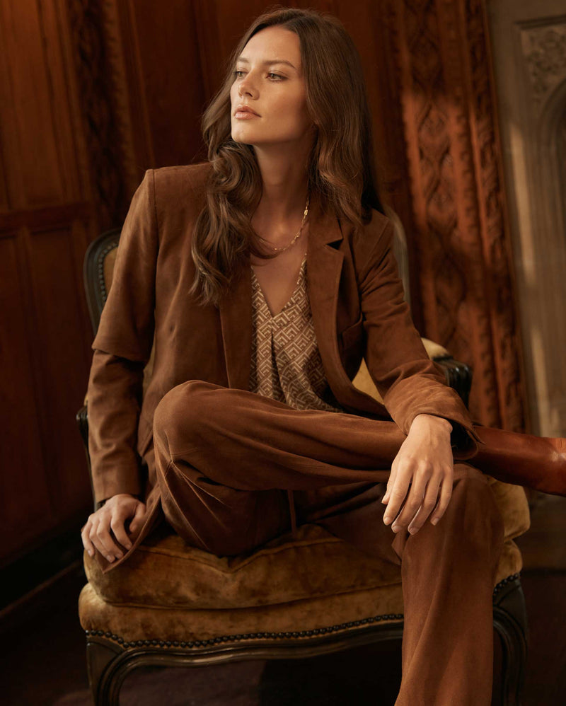 Female model wears the Suede Blazer with matching Suede Track Pant