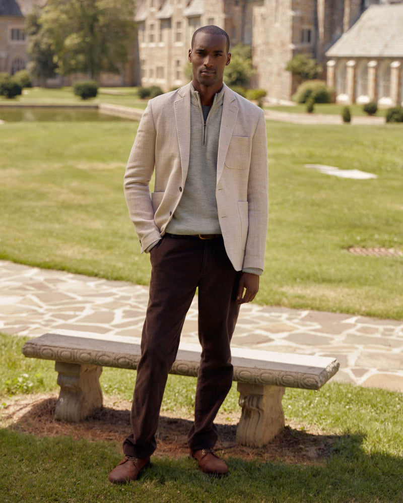 Male model wears the Archie Jacket in Tan