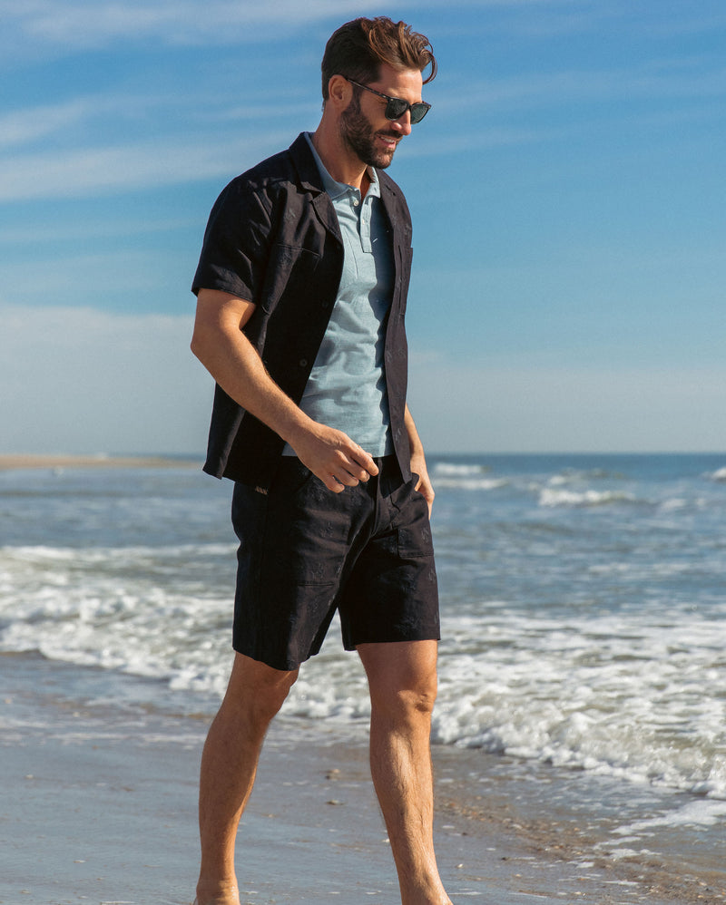 Male model wears the Pelican Embroidered Shirt with matching Embroidered Panel Short