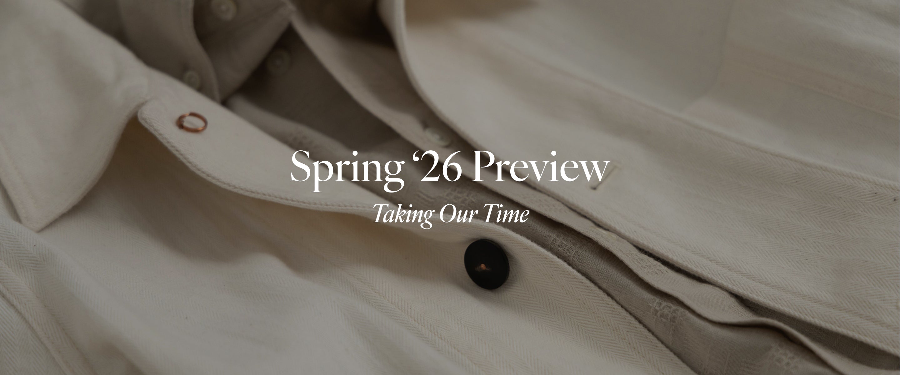 Text reading Spring '26 Preview: Taking Our Time overlaid a close-up image of a chore coat.