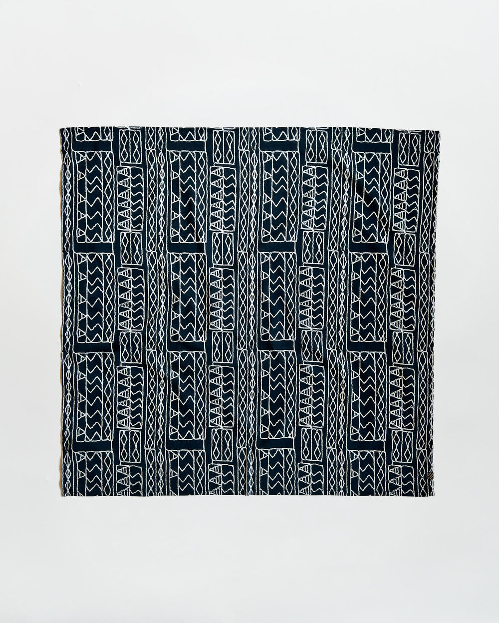 Black and white patterned fabric on a light gray background