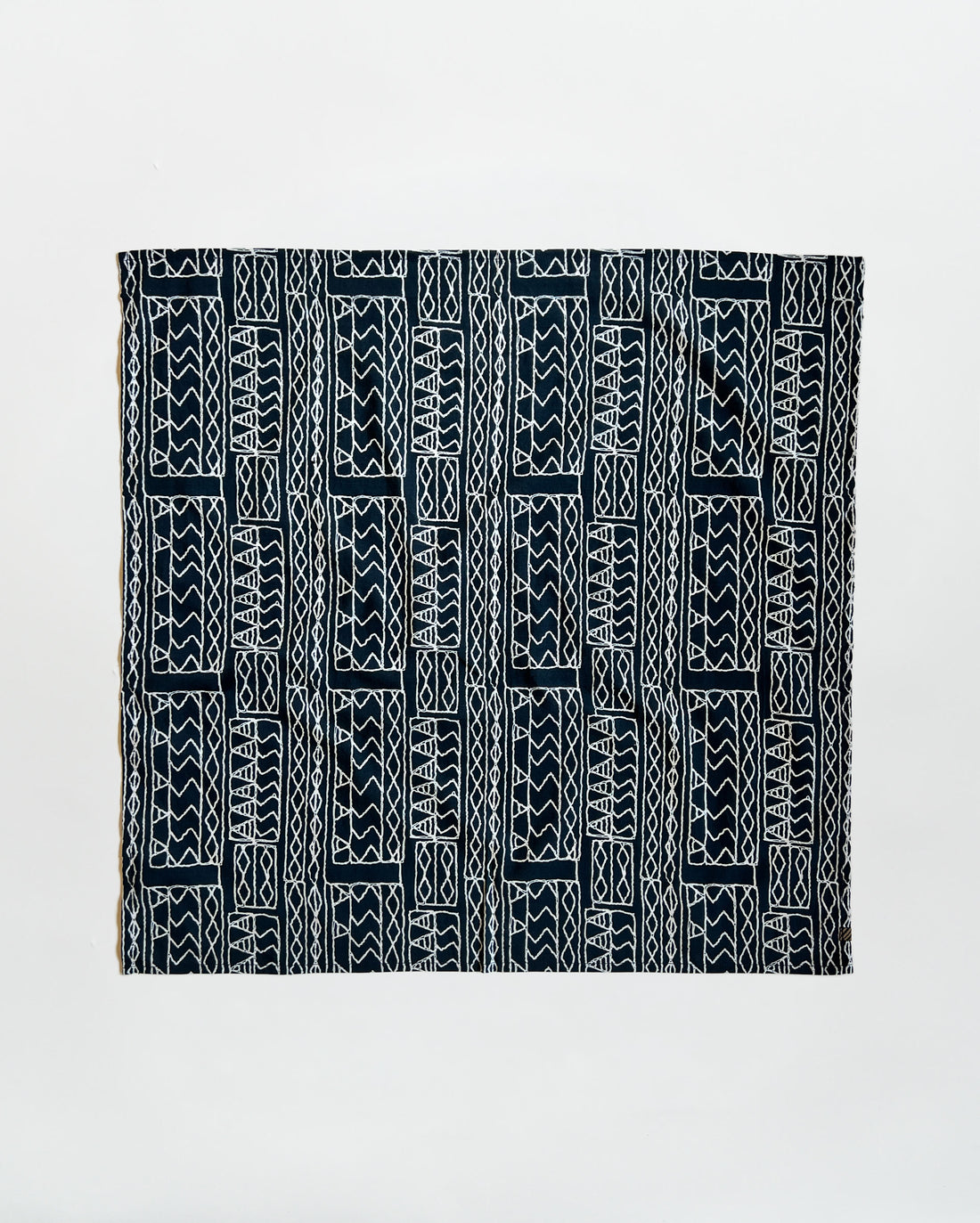 Black and white patterned fabric on a light gray background