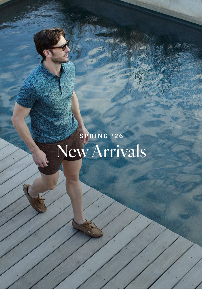 Man walking by a pool with 'Spring '26 New Arrivals' text overlay