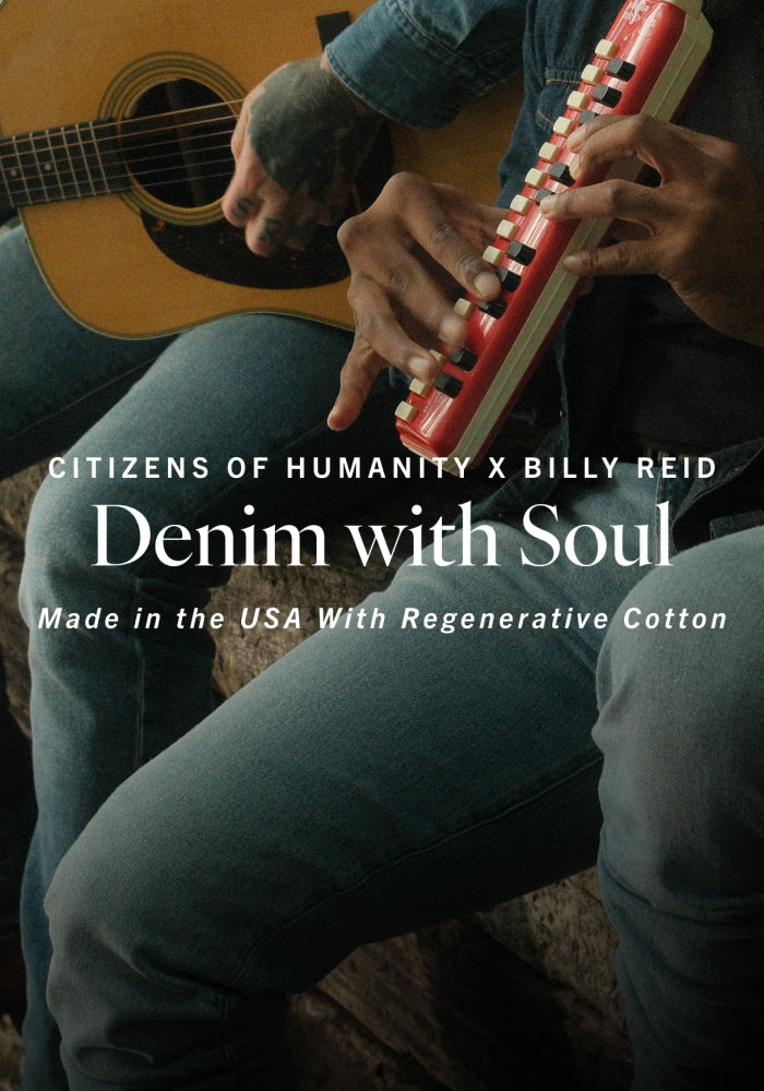 Person playing a red and white instrument with text about Citizens of Humanity and Billy Reid denim.