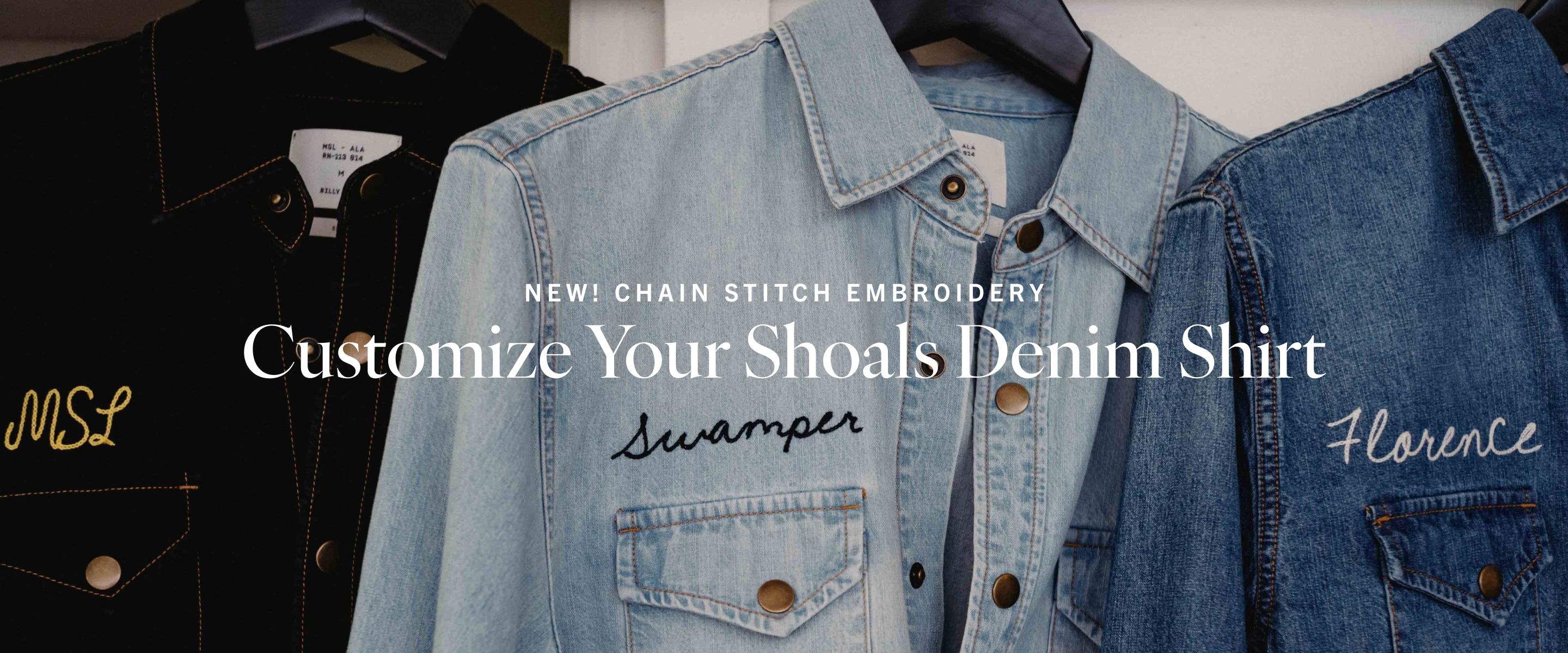 Denim shirt with chain stitch embroidery and text on a white background