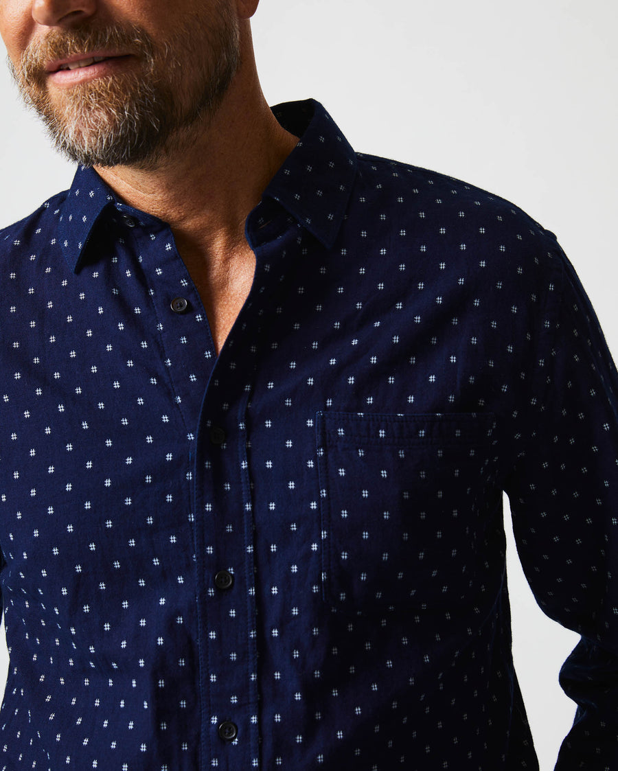 Male model wears the Tuscumbia Shirt in Indigo/White