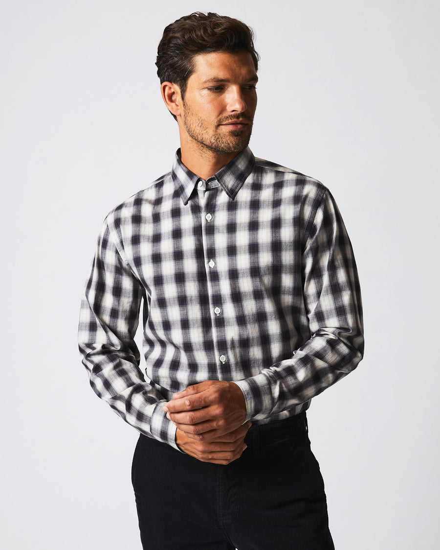 Male model wears the Shadow Plaid Tuscumbia Shirt Hidden Button Down in Black/Natural