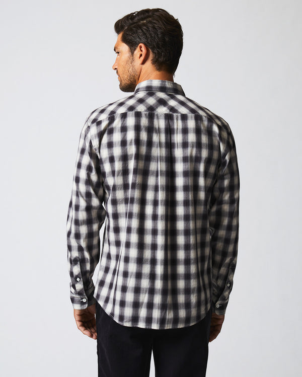 Male model wears the Shadow Plaid Tuscumbia Shirt Hidden Button Down in Black/Natural