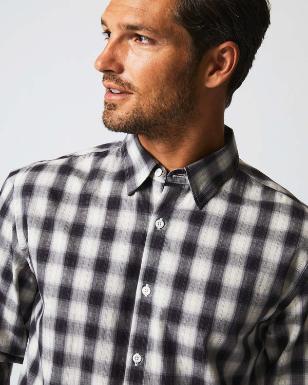 Male model wears the Shadow Plaid Tuscumbia Shirt Hidden Button Down in Black/Natural