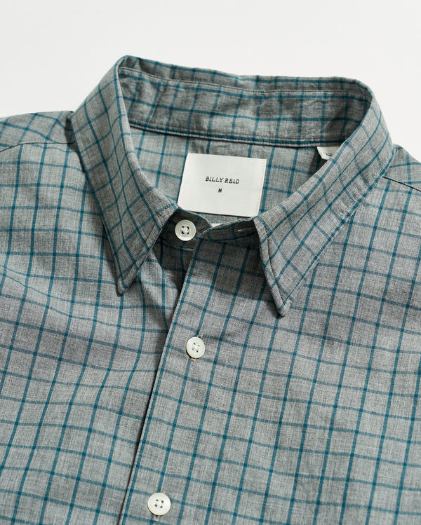 Male model wears the Melange Windowpane Tuscumbia Shirt Hidden Button Down in Grey/Teal