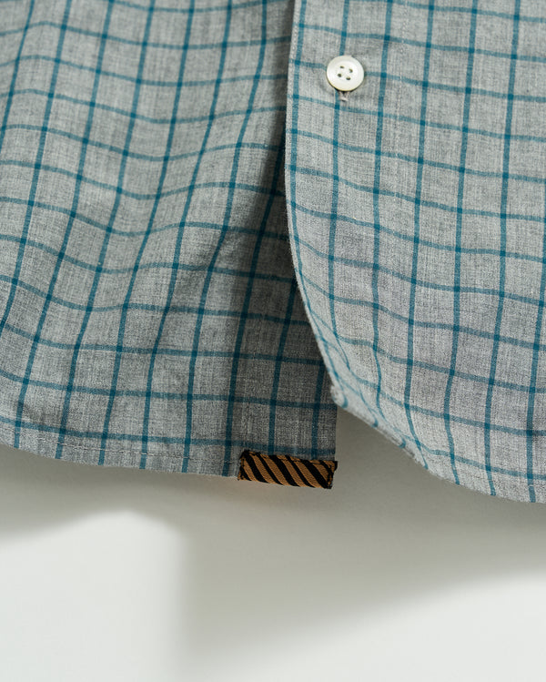 Male model wears the Melange Windowpane Tuscumbia Shirt Hidden Button Down in Grey/Teal