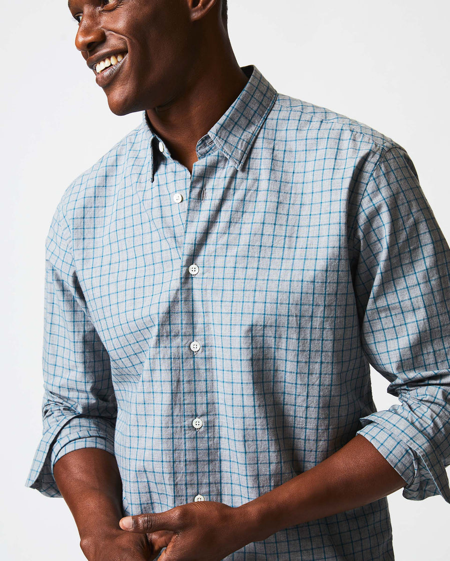 Male model wears the Melange Windowpane Tuscumbia Shirt Hidden Button Down in Grey/Teal