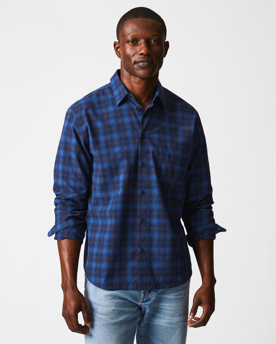 Male model wears the melange shadow plaid tuscumbia shirt in blue/red