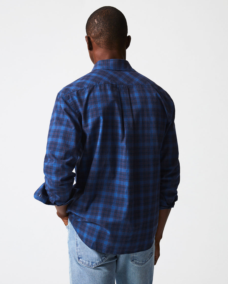 Male model wears the melange shadow plaid tuscumbia shirt in blue/red