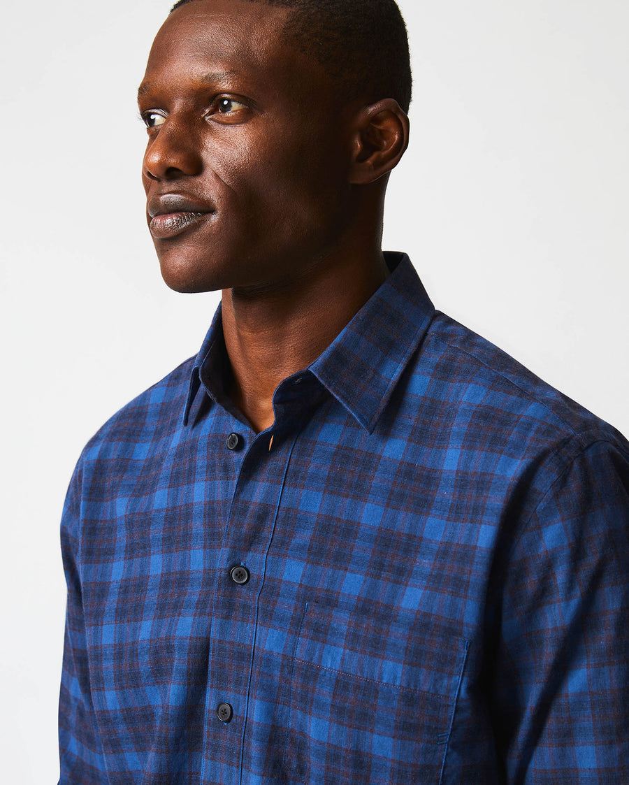 Male model wears the melange shadow plaid tuscumbia shirt in blue/red