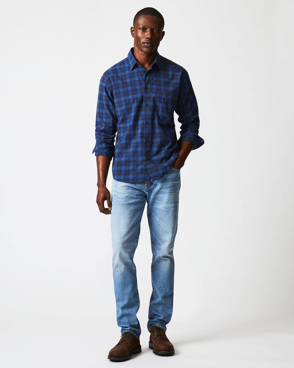 Male model wears the melange shadow plaid tuscumbia shirt in blue/red