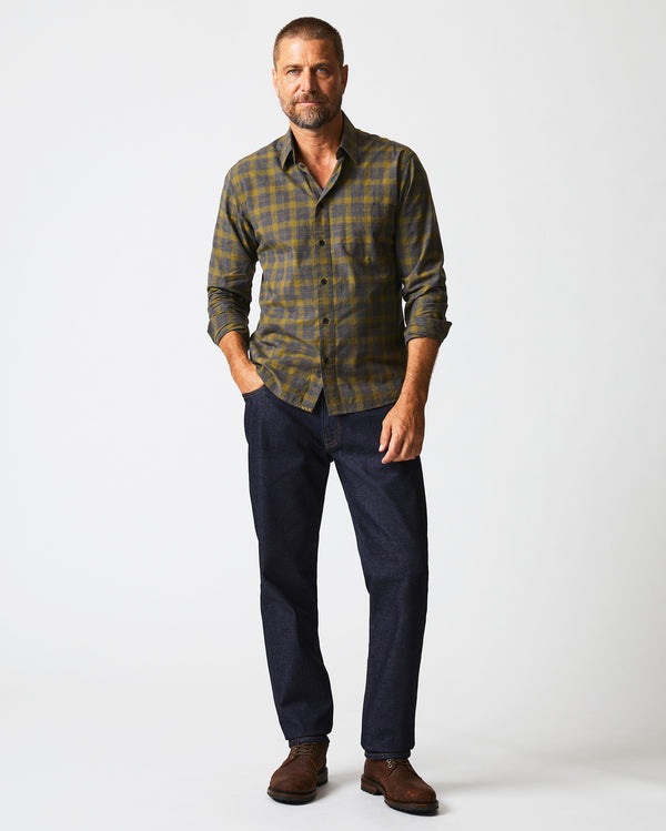 Male model wears the Melange Shadow Plaid Tuscumbia Shirt in Grey/Olive