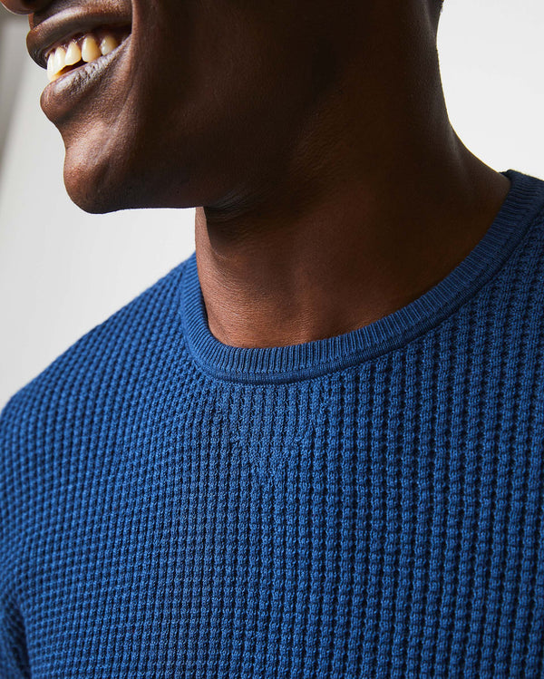 Male model wears the Mini Waffle Crew in Denim Blue