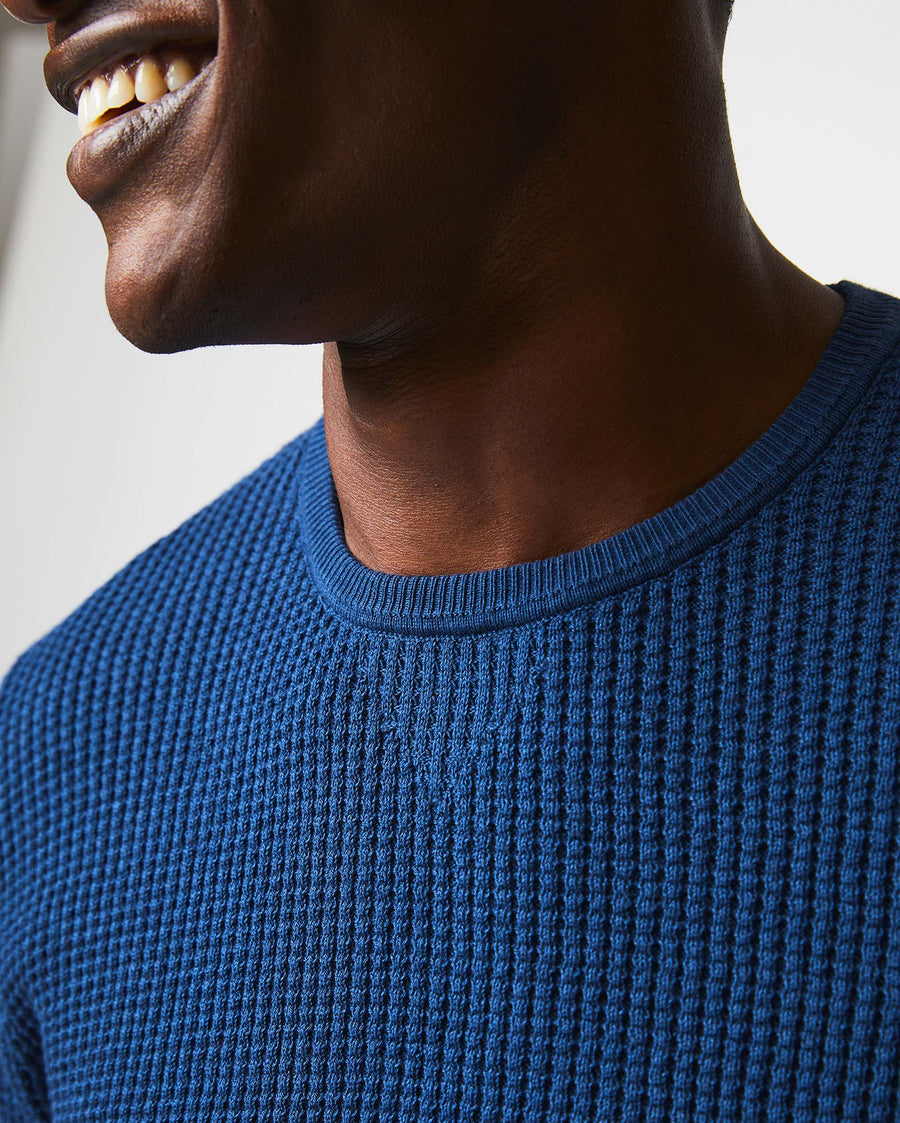 Male model wears the Mini Waffle Crew in Denim Blue