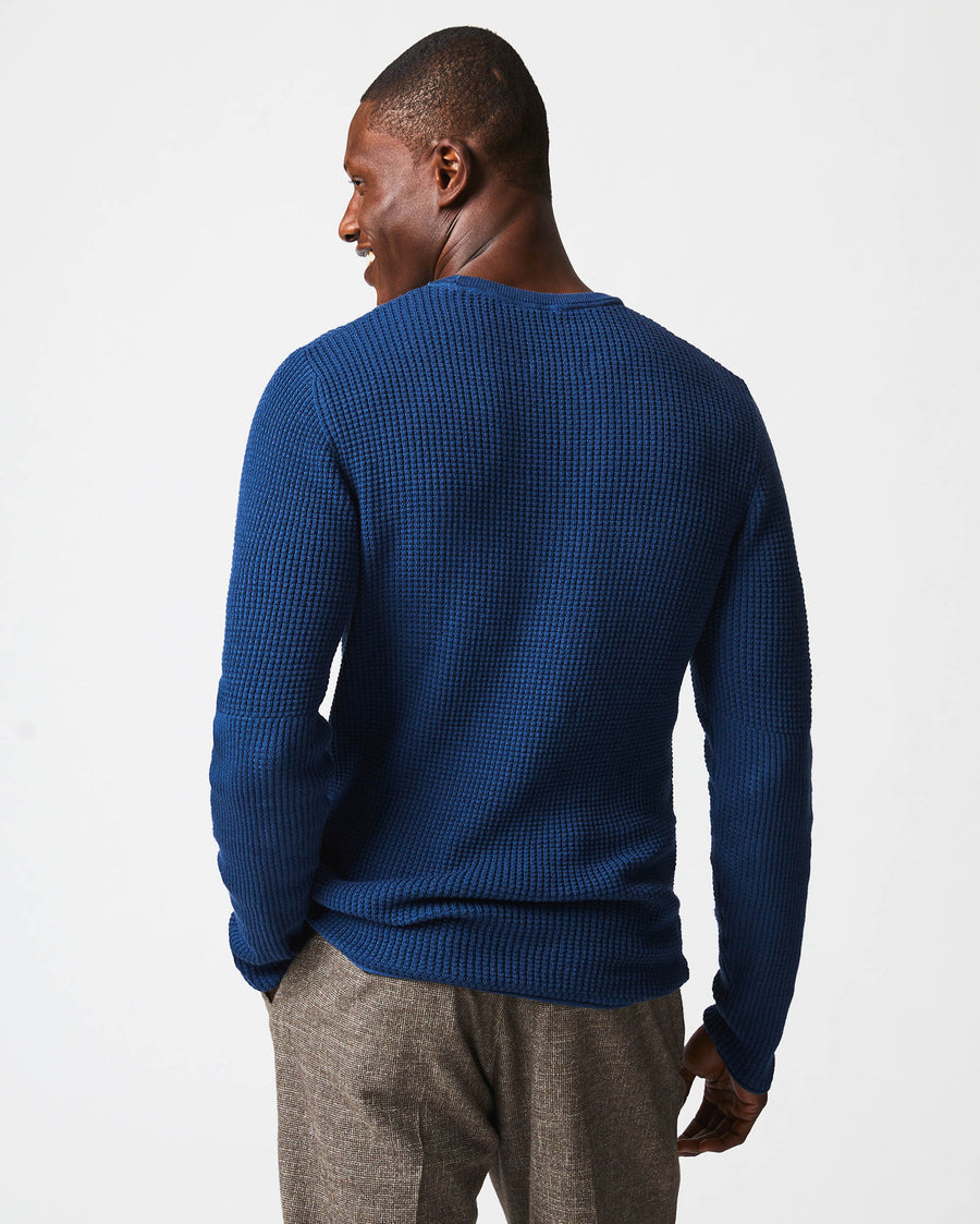 Male model wears the Mini Waffle Crew in Denim Blue