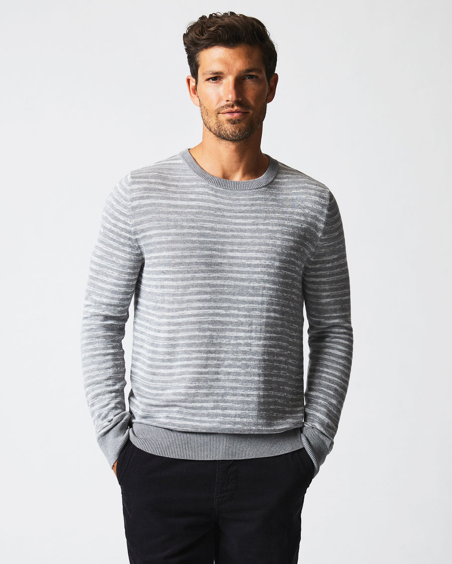 Male model wears the Space Dye Stripe Crew in Grey