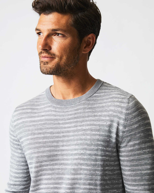 Male model wears the Space Dye Stripe Crew in Grey
