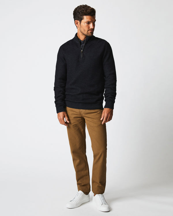 Male model wears the Merino Half Zip in Black