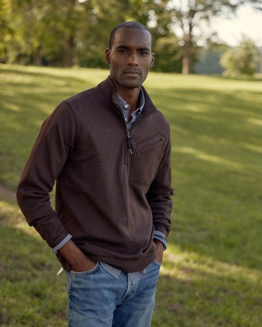 Male model wears the Quilted Half Zip in Chocolate