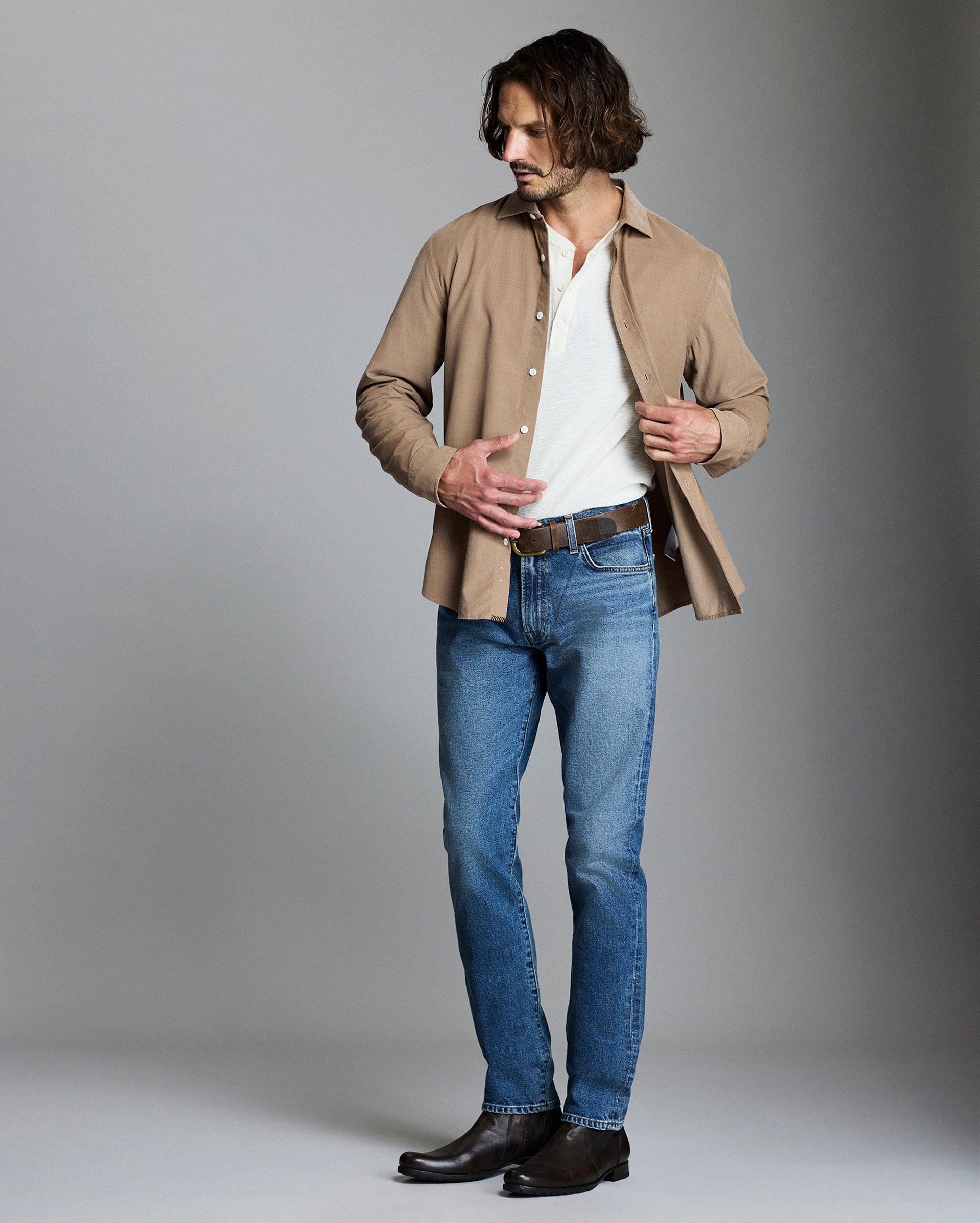 Model wears the corduroy cedar shirt over a polo