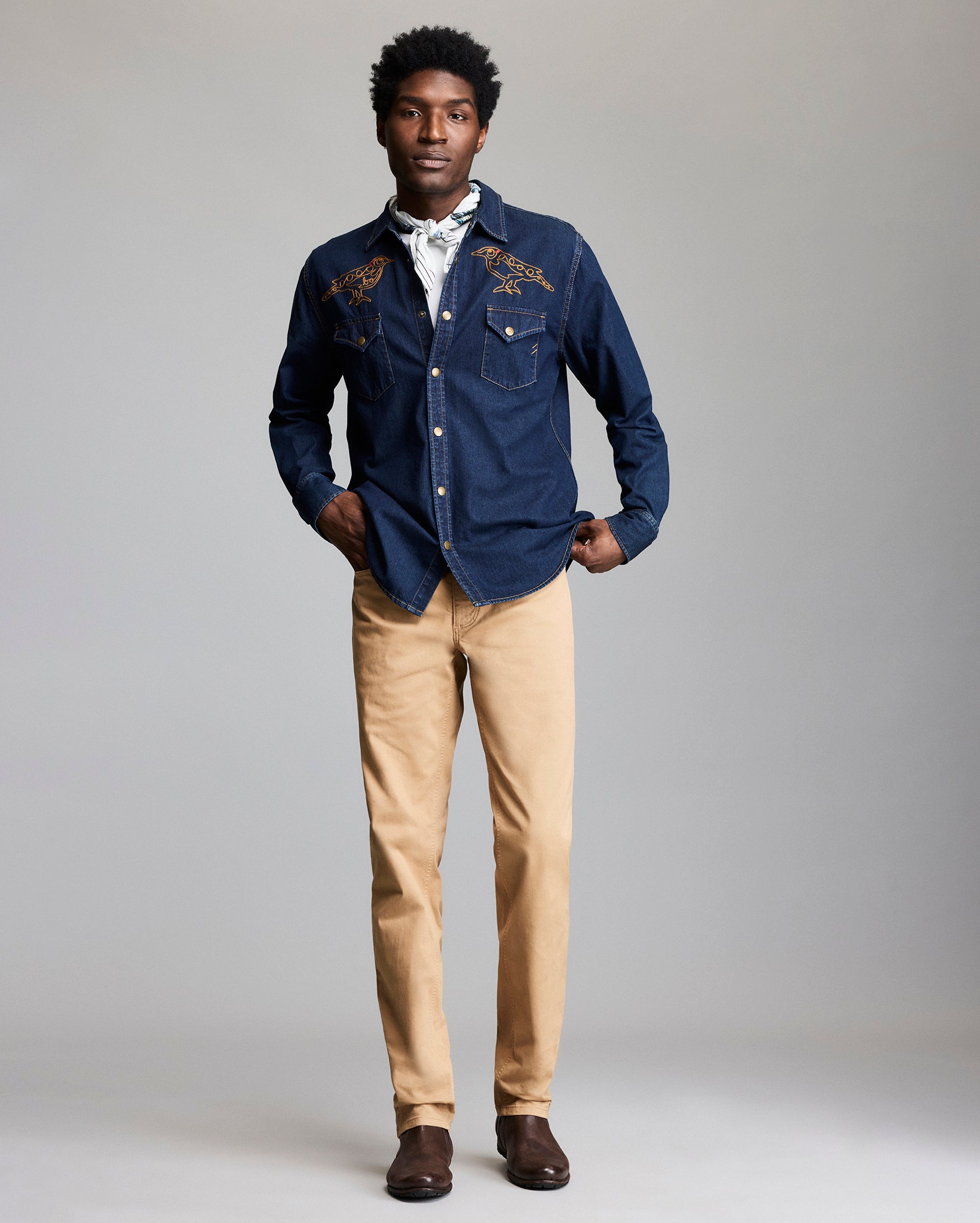 Model shows the shirt from the front, with the yellowhammer embroidery clearly visible at the chest.