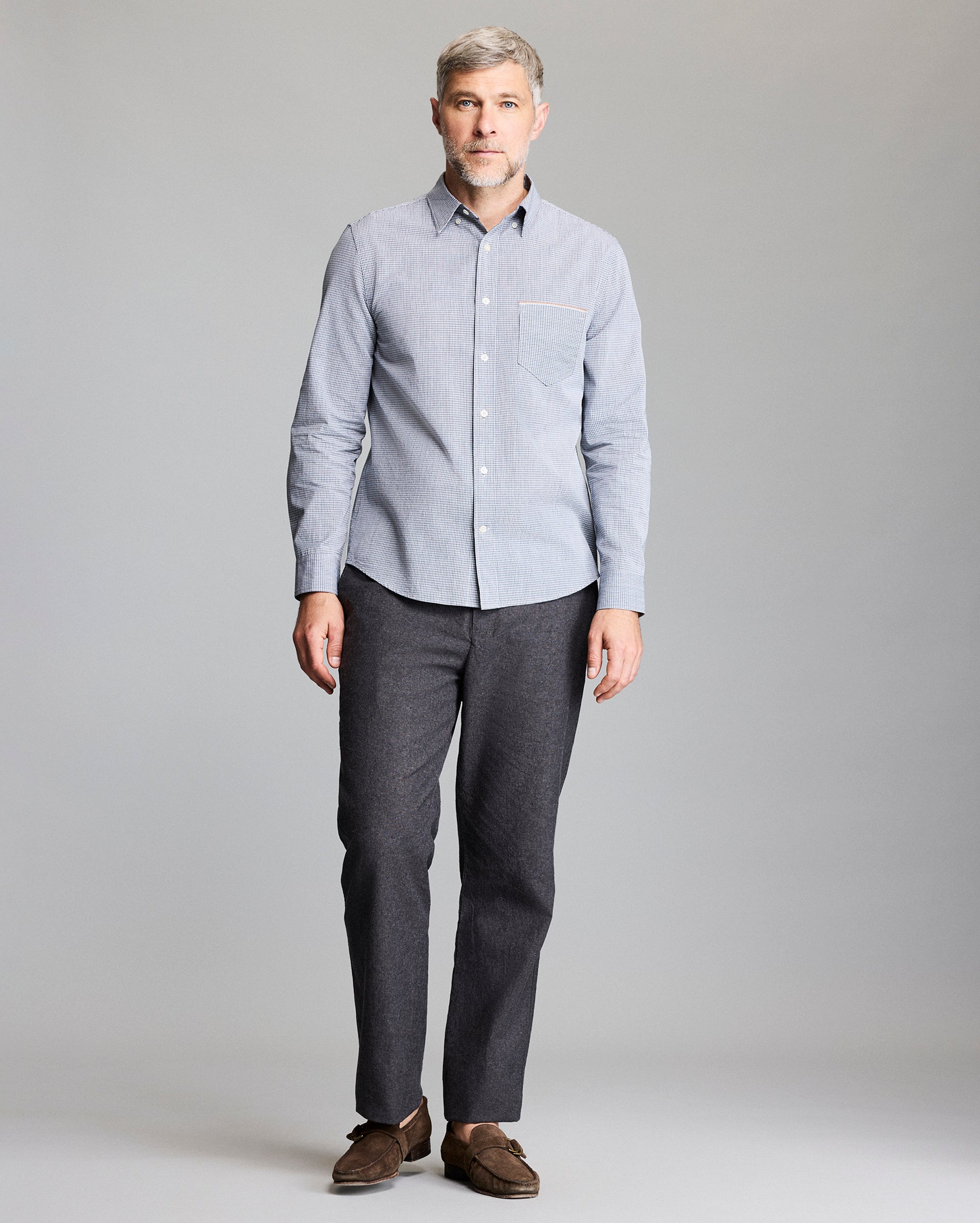 Model wears the button up shirt
