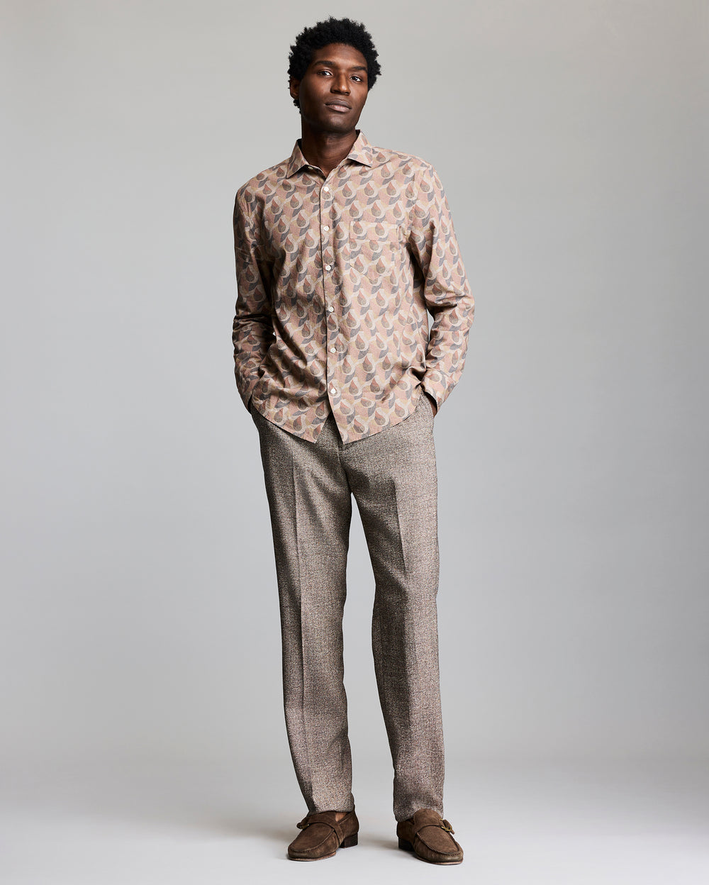Model shows. the fit of the shirt