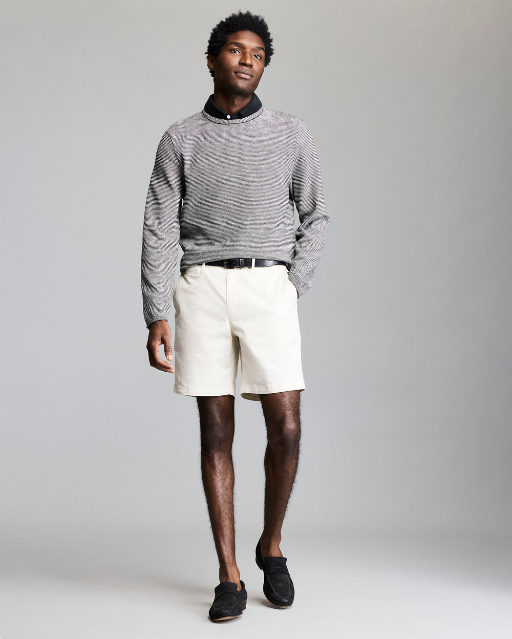 Model wears the Tuck Stripe Crew in Black