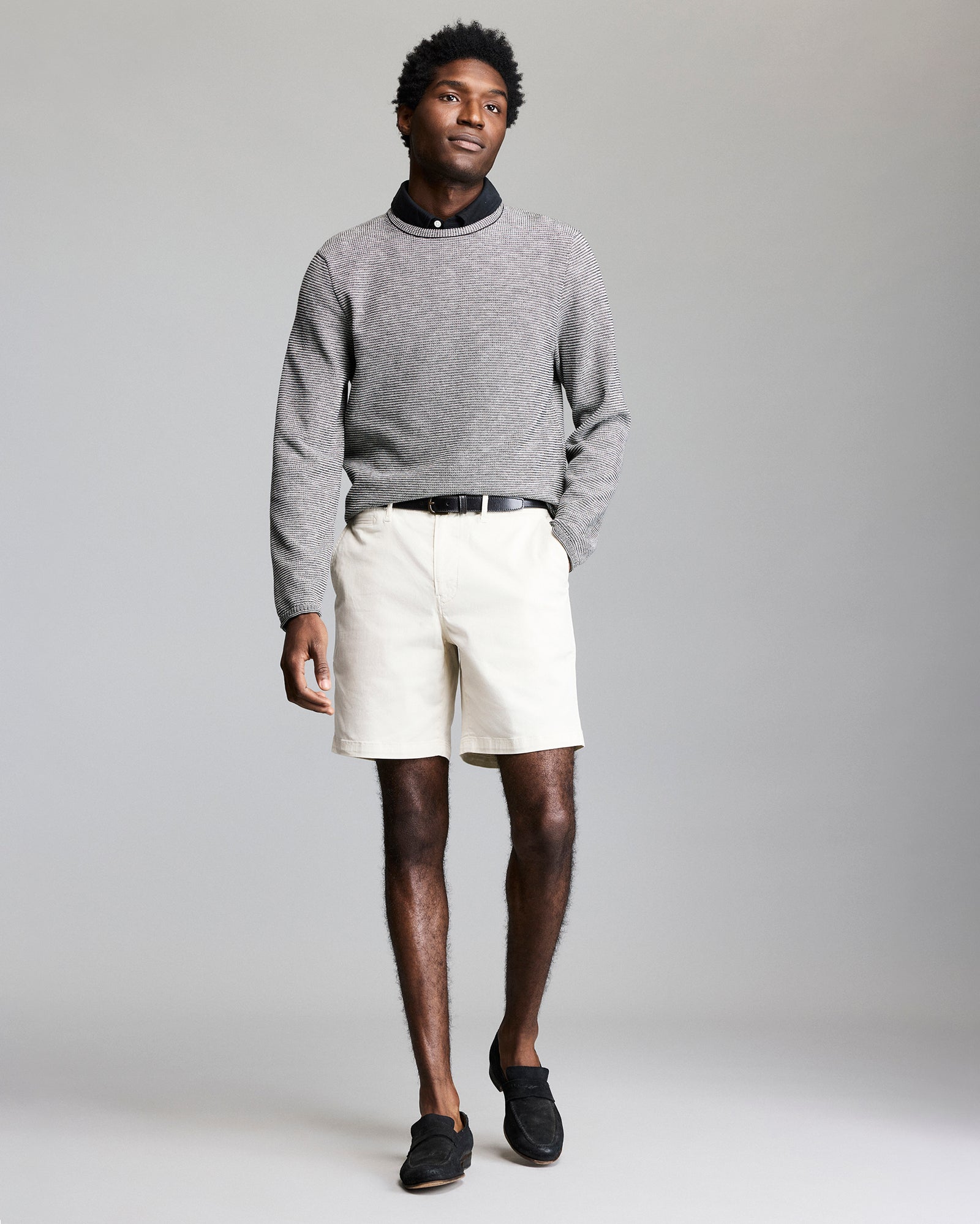 Model wears the Tuck Stripe Crew in Black
