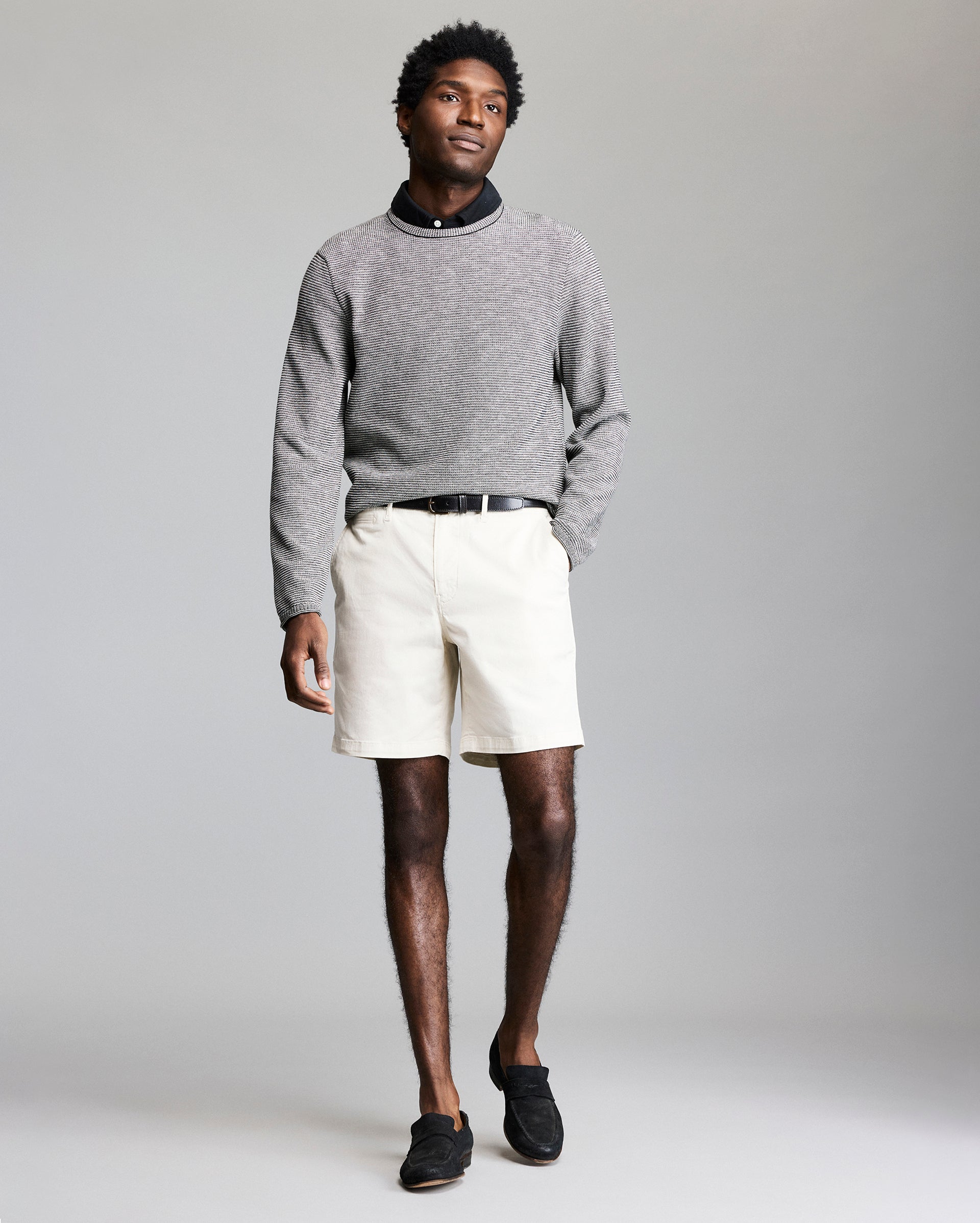 Model wears the Tuck Stripe Crew in Black