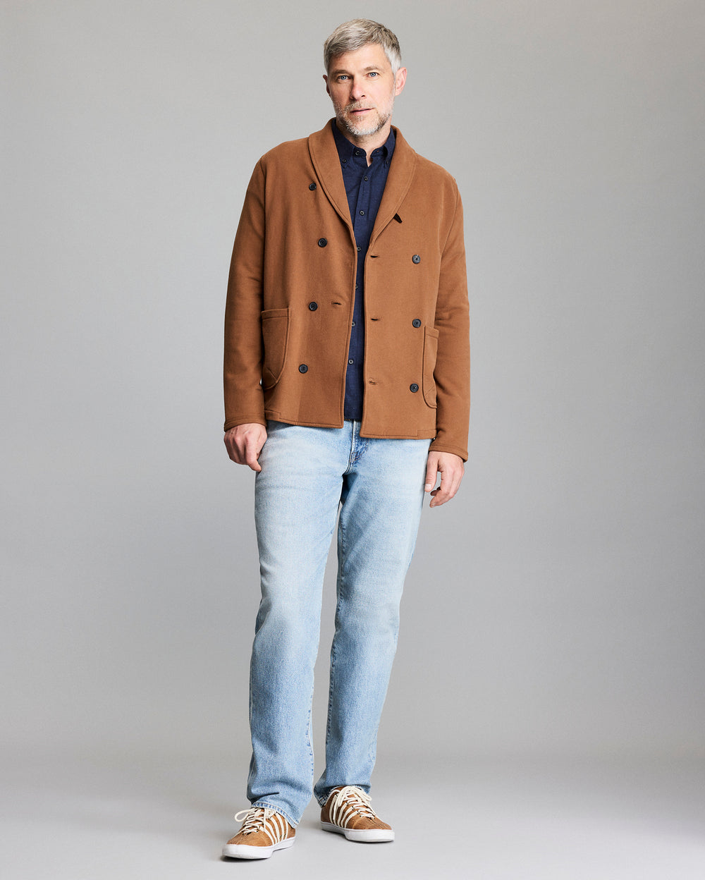 Male model shows the fit of the cardigan