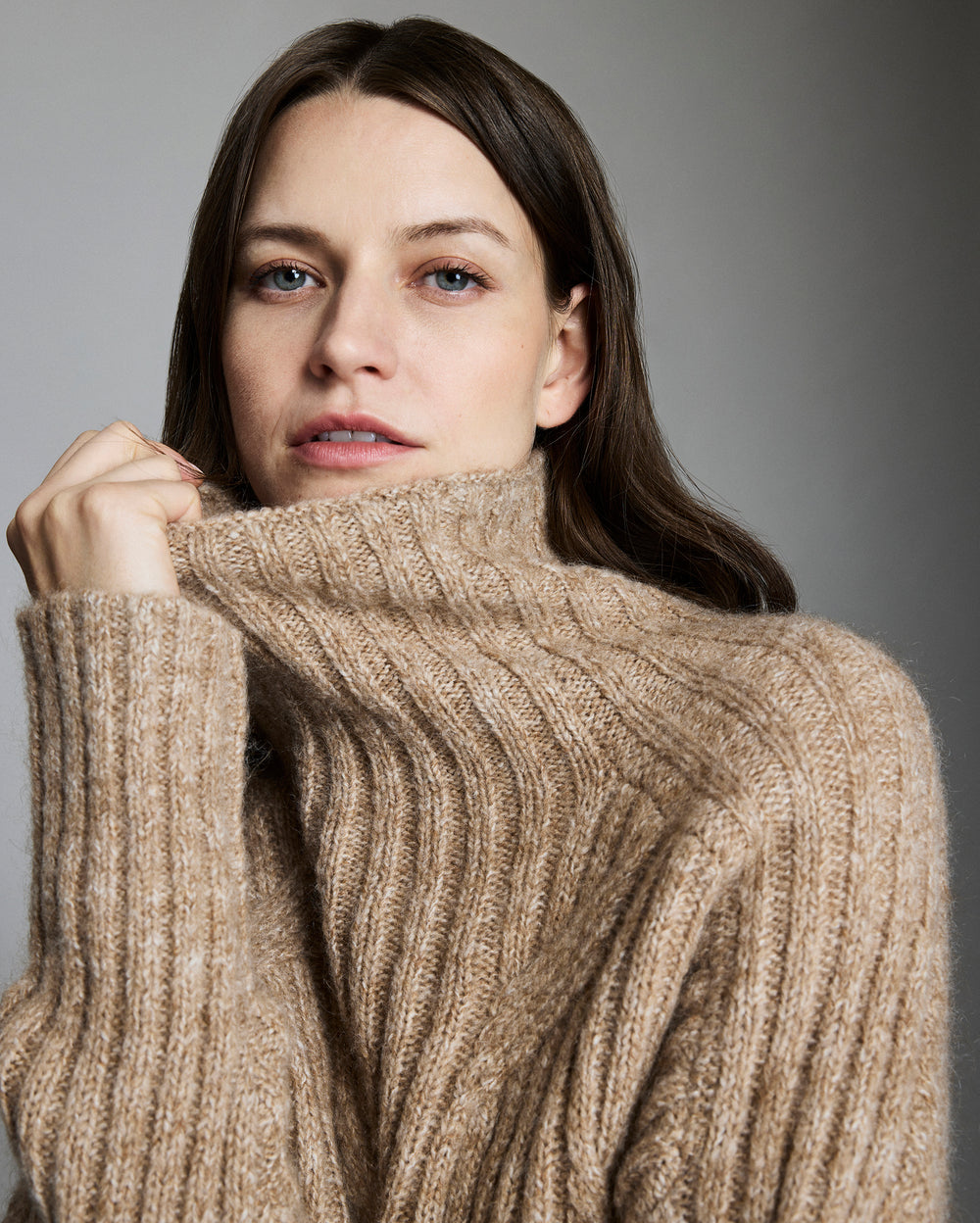 Model shows the collar of the sweater