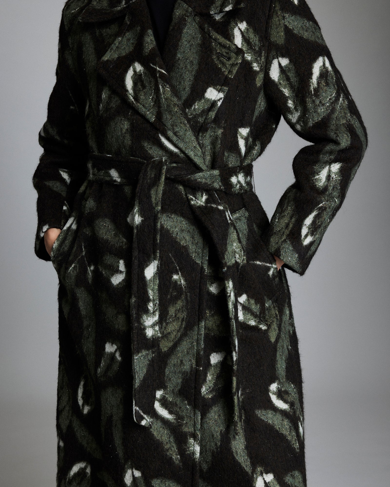 Black patterned coat on a gray background