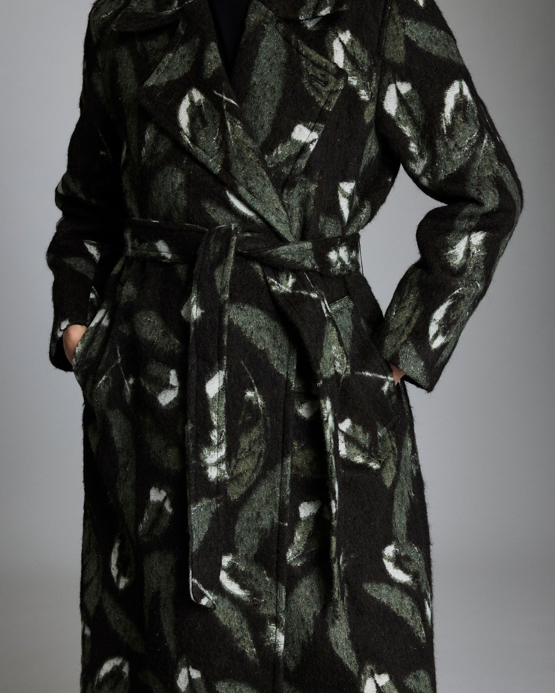 Black patterned coat on a gray background