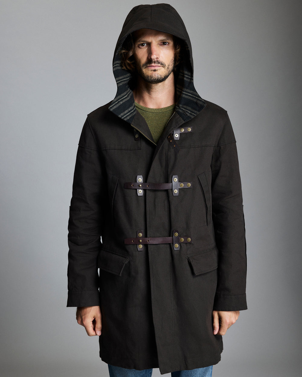 Model shows the jacket with the hood pulled up