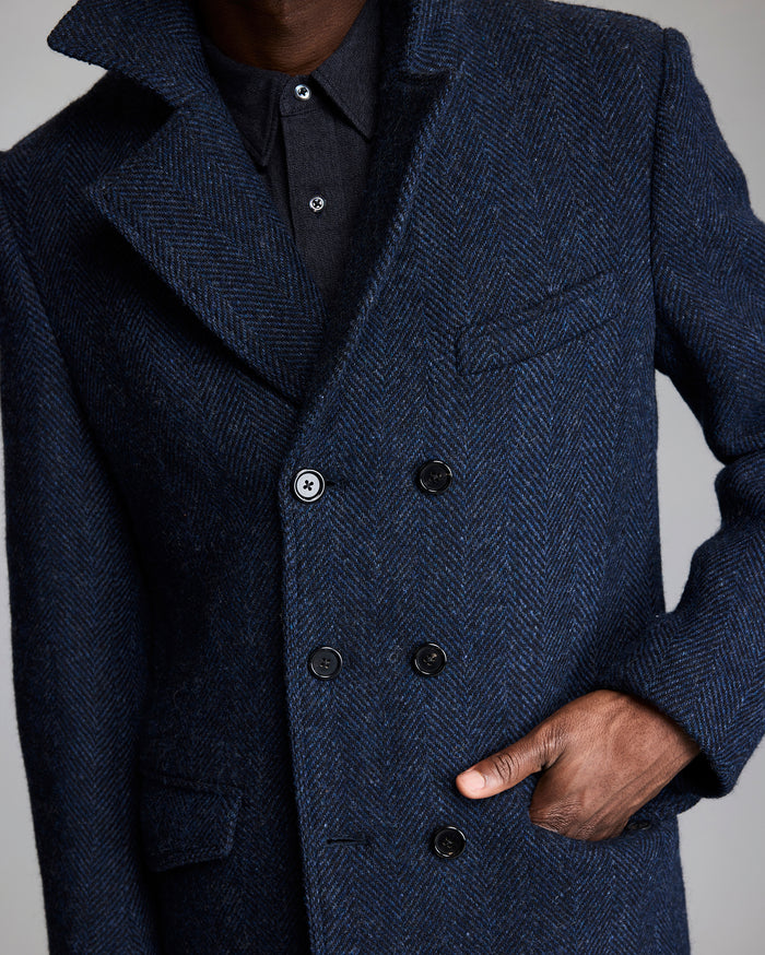 Model shows the pockets of the coat