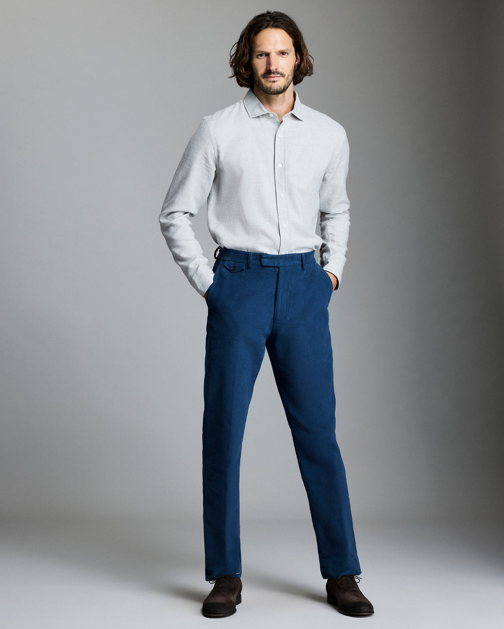 Model wears the Moleskin Flat Front Trouser in Denim Blue