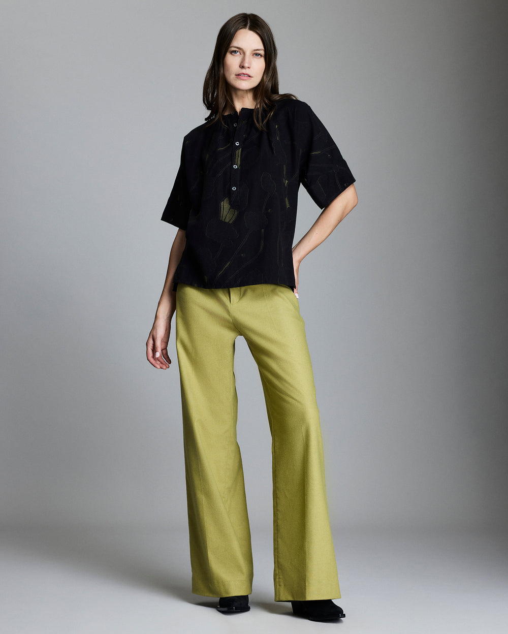 Model wears the Poppy Jacquard Poet Blouse in Navy/Moss