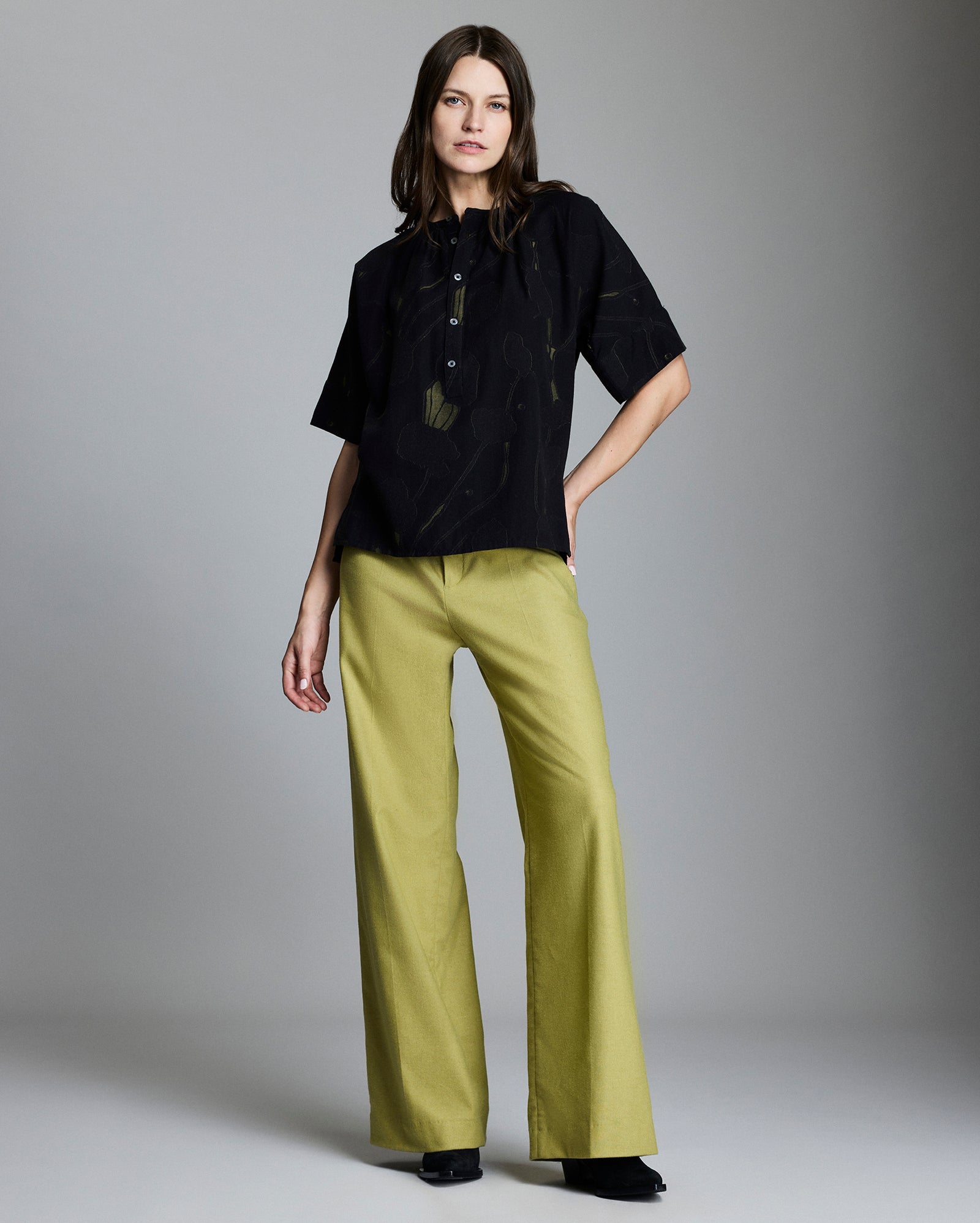 Model wears the Poppy Jacquard Poet Blouse in Navy/Moss