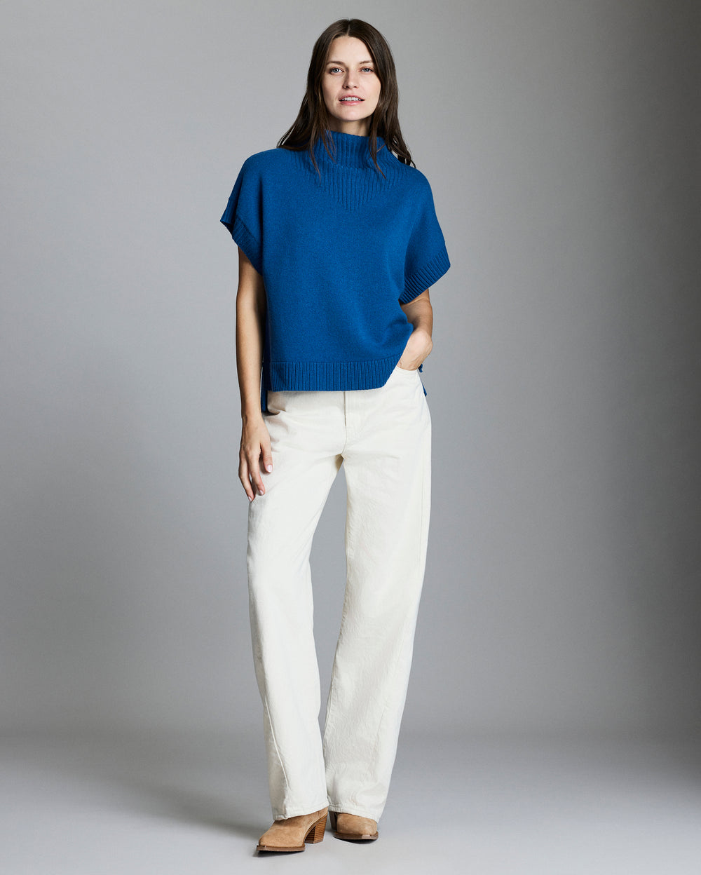 Model wears the funnel shell sweater